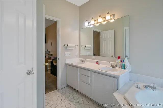 a bathroom with a double vanity sink mirror and double