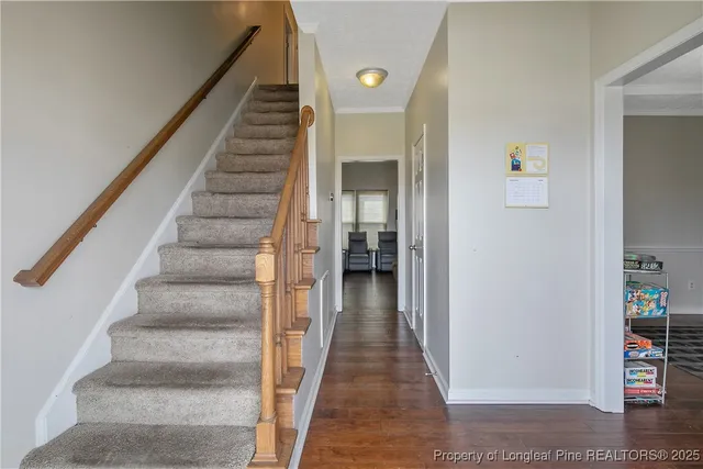 a view of staircase with white walls