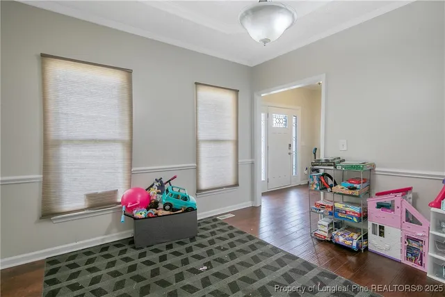 a room with toys and wooden floor
