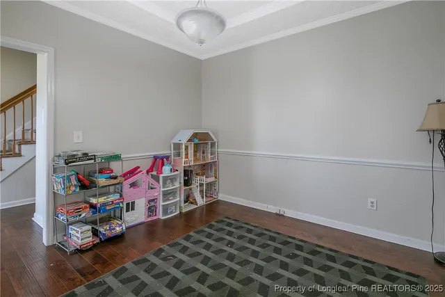 a room with toys and wooden floor