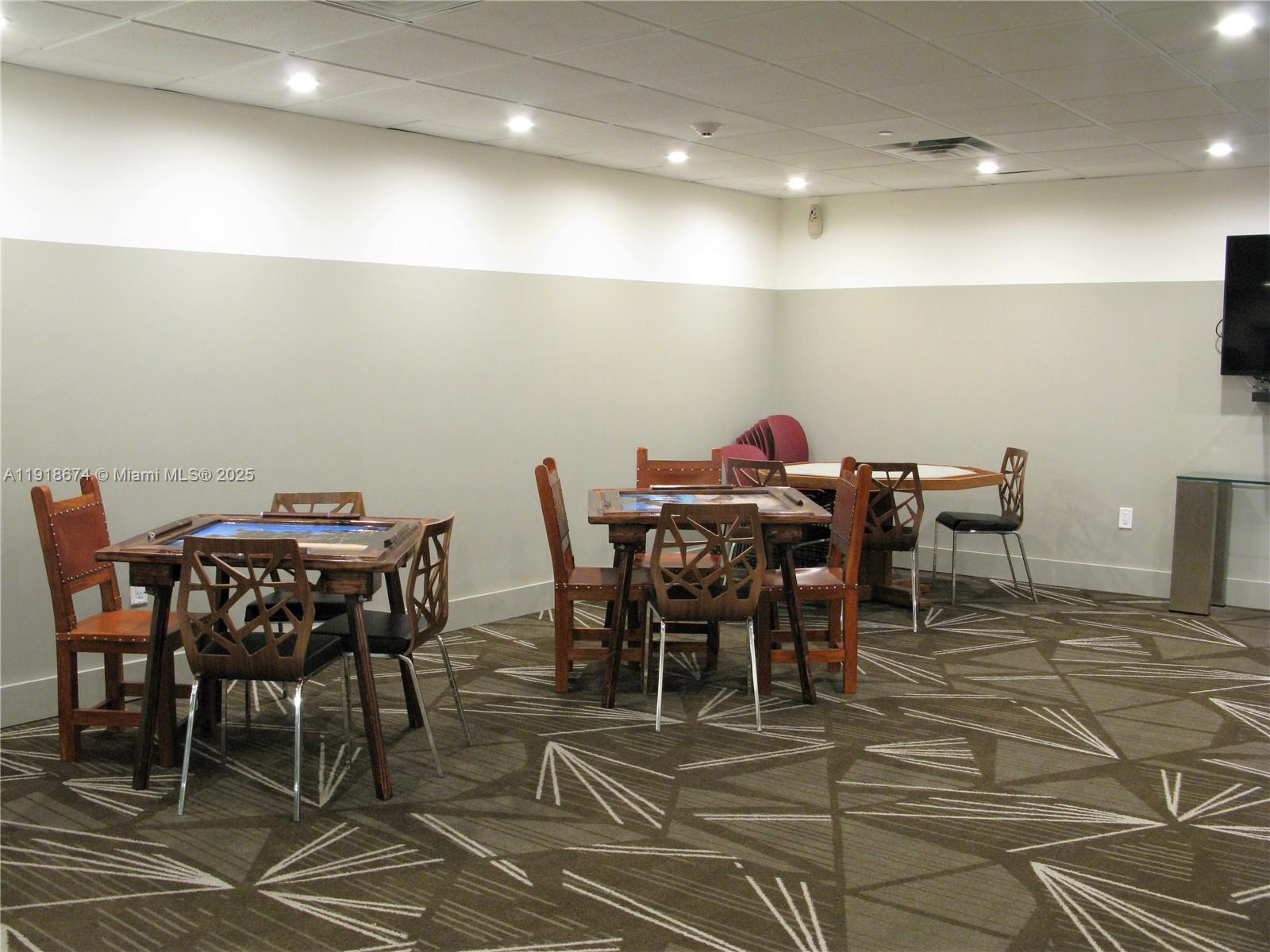 5701 Collins Avenue, Unit 808 Miami Beach, FL 33140 - Photo 35 of 40 a view of a dining room with furniture