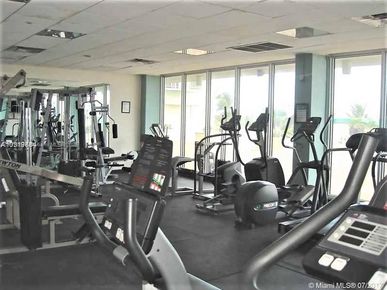 5701 Collins Avenue, Unit 808 Miami Beach, FL 33140 - Photo 39 of 40 a view of a room with gym equipment