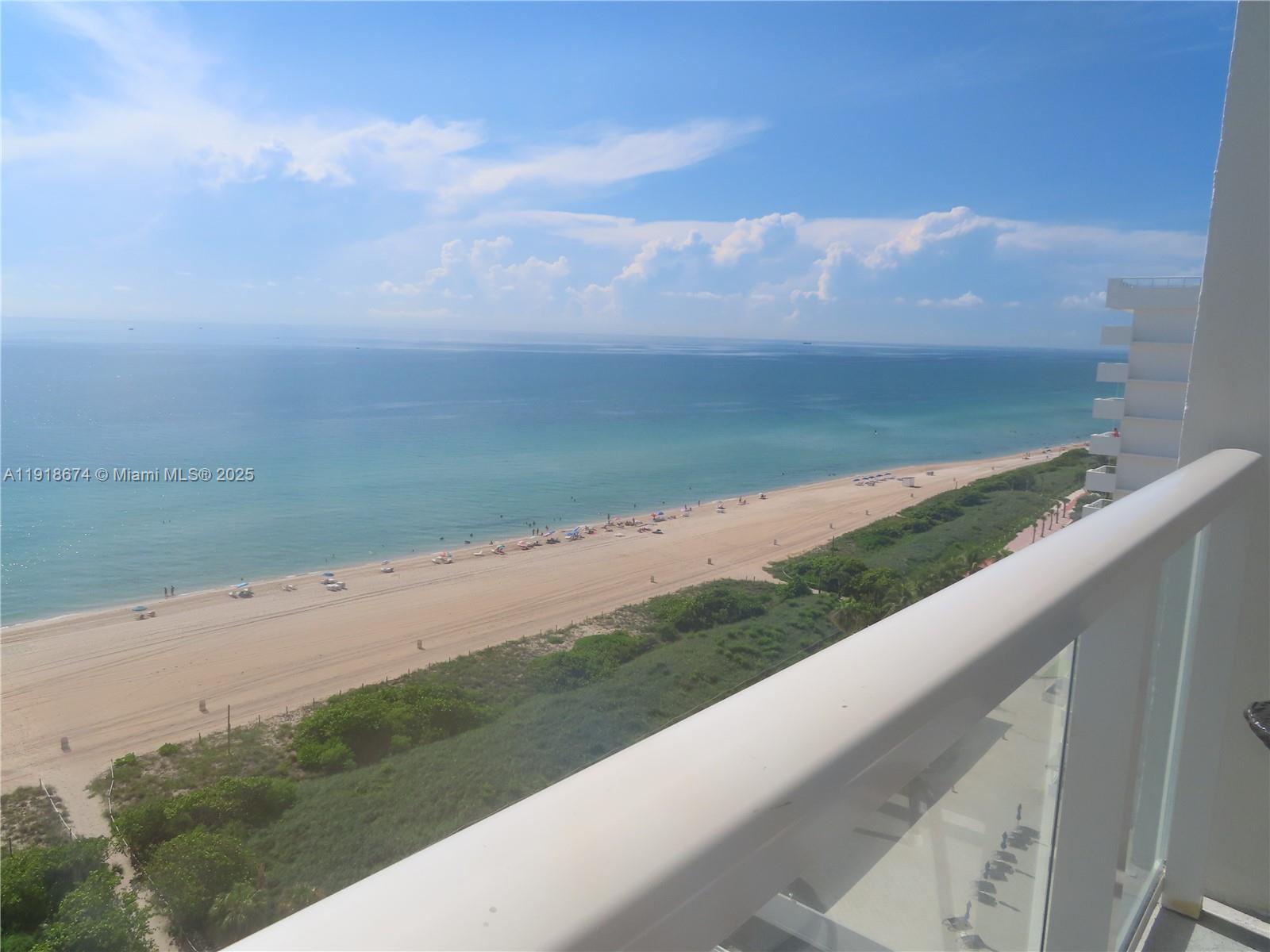 5701 Collins Avenue, Unit 808 Miami Beach, FL 33140 - Photo 4 of 40 a view of a yard with an ocean view