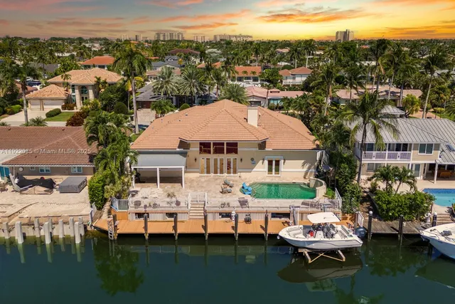 a view of a lake with a table and chairs