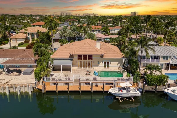 a view of a lake with a table and chairs