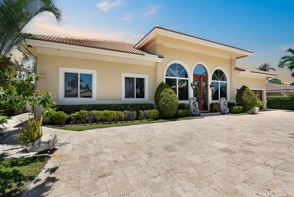 a front view of a house with garden