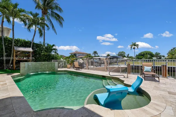 a view of a house with a yard porch and sitting area