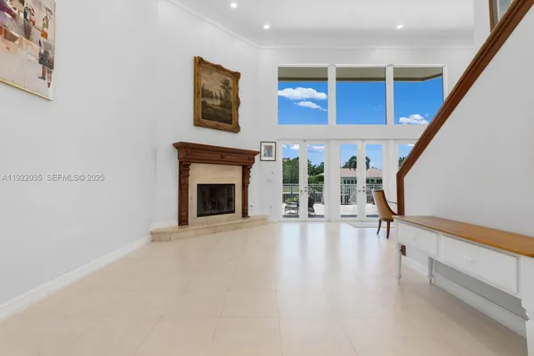 a view of an empty room with a fireplace
