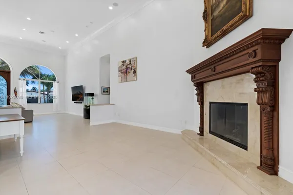 a view of an empty room and a fireplace