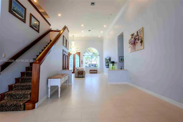 a view of an entryway with wooden floor