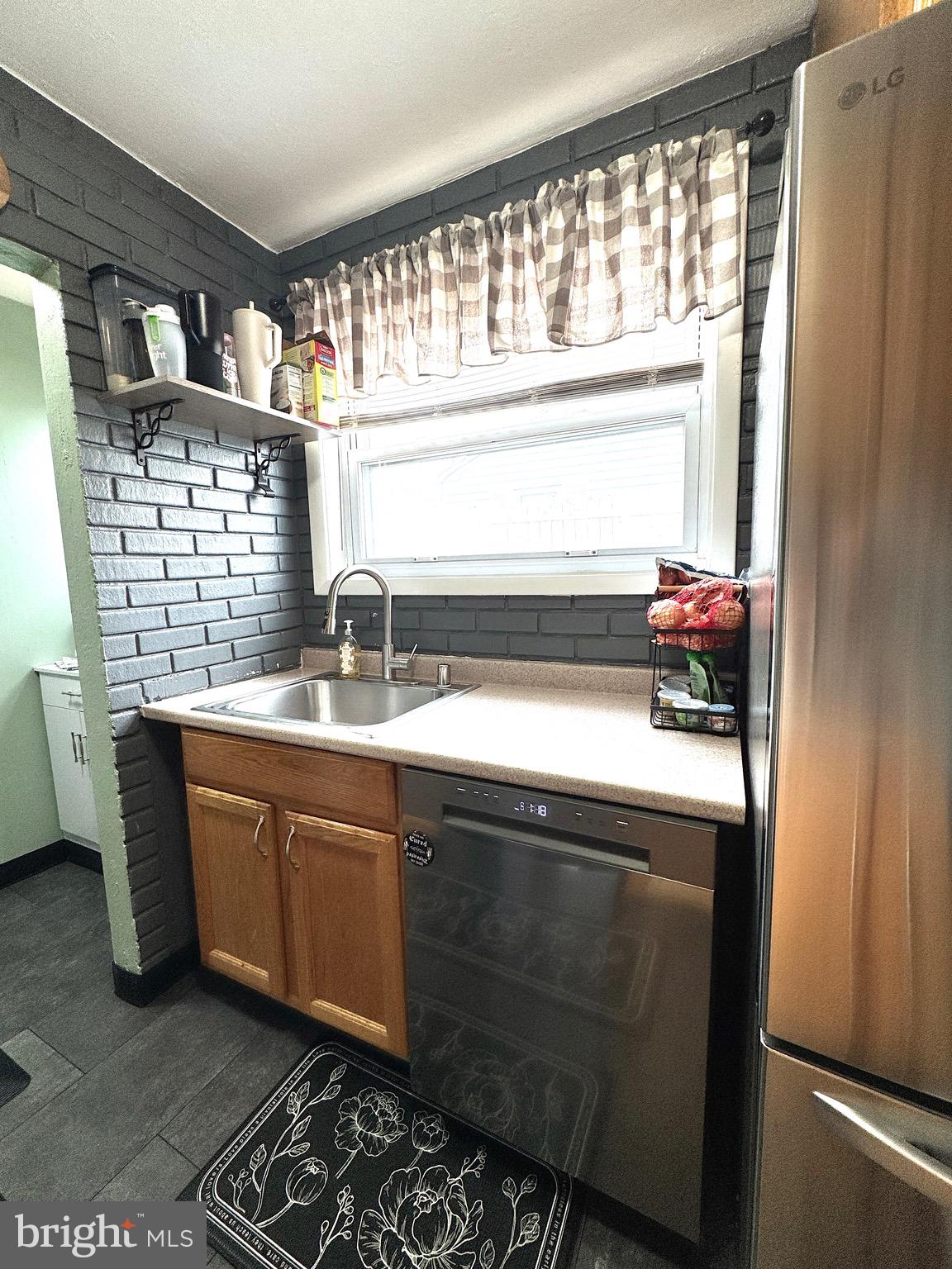 1046 Thomas Road Glen Burnie, MD 21060 - Photo 14 of 30 a view of a sink and a microwave