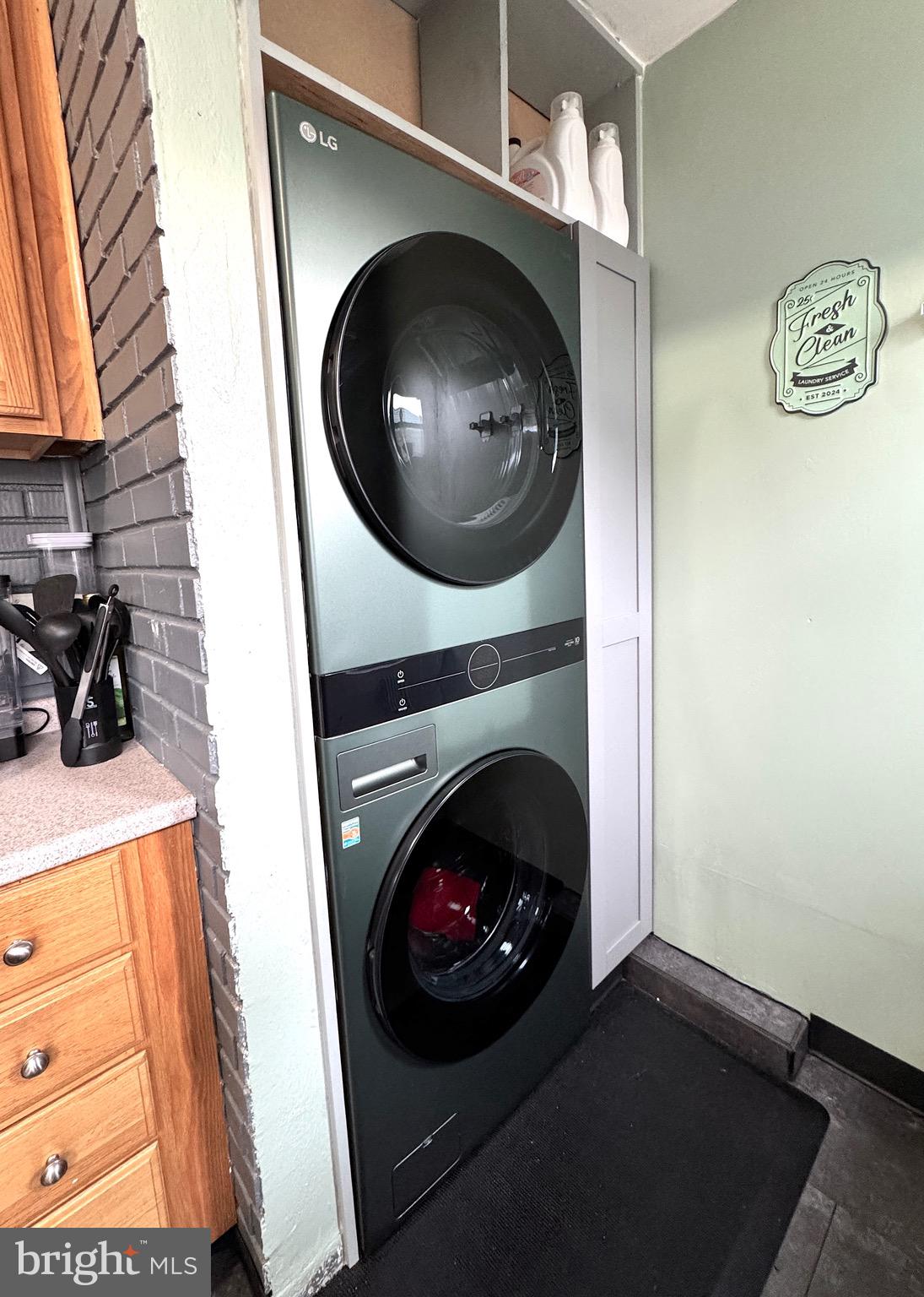 1046 Thomas Road Glen Burnie, MD 21060 - Photo 15 of 30 a view of a livingroom with washer and dryer