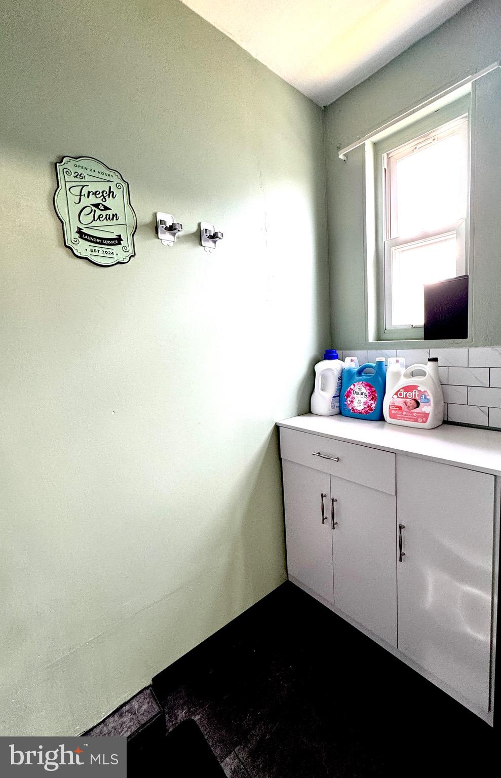 1046 Thomas Road Glen Burnie, MD 21060 - Photo 16 of 30 a bathroom with a sink and a window