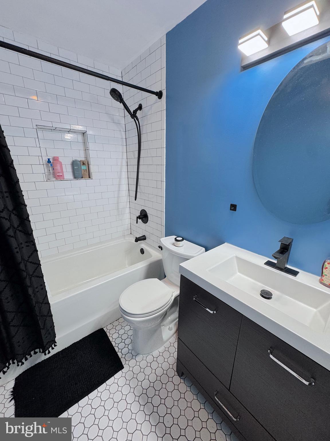 1046 Thomas Road Glen Burnie, MD 21060 - Photo 18 of 30 a bathroom with a sink a toilet and shower