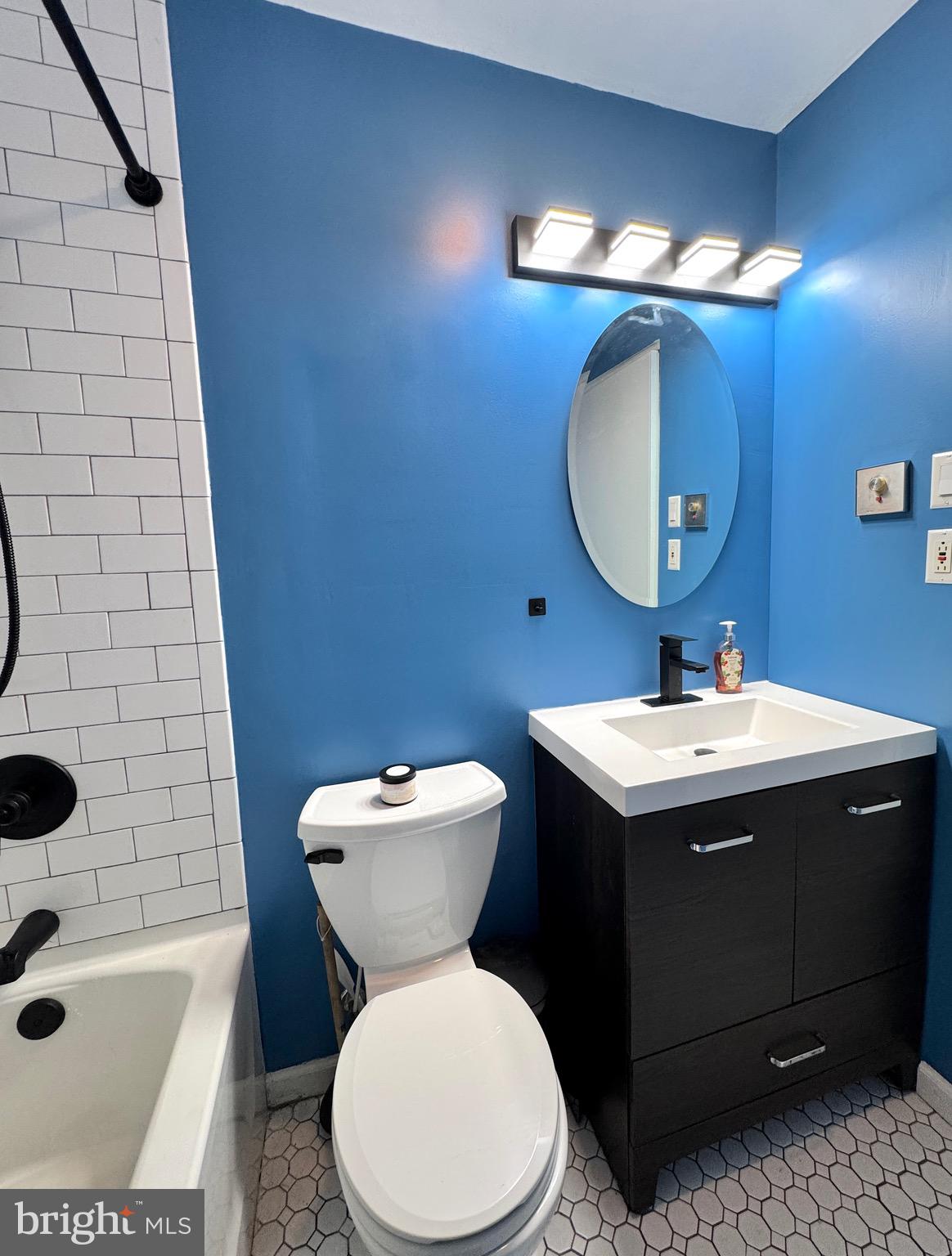 1046 Thomas Road Glen Burnie, MD 21060 - Photo 19 of 30 a bathroom with a sink toilet and shower