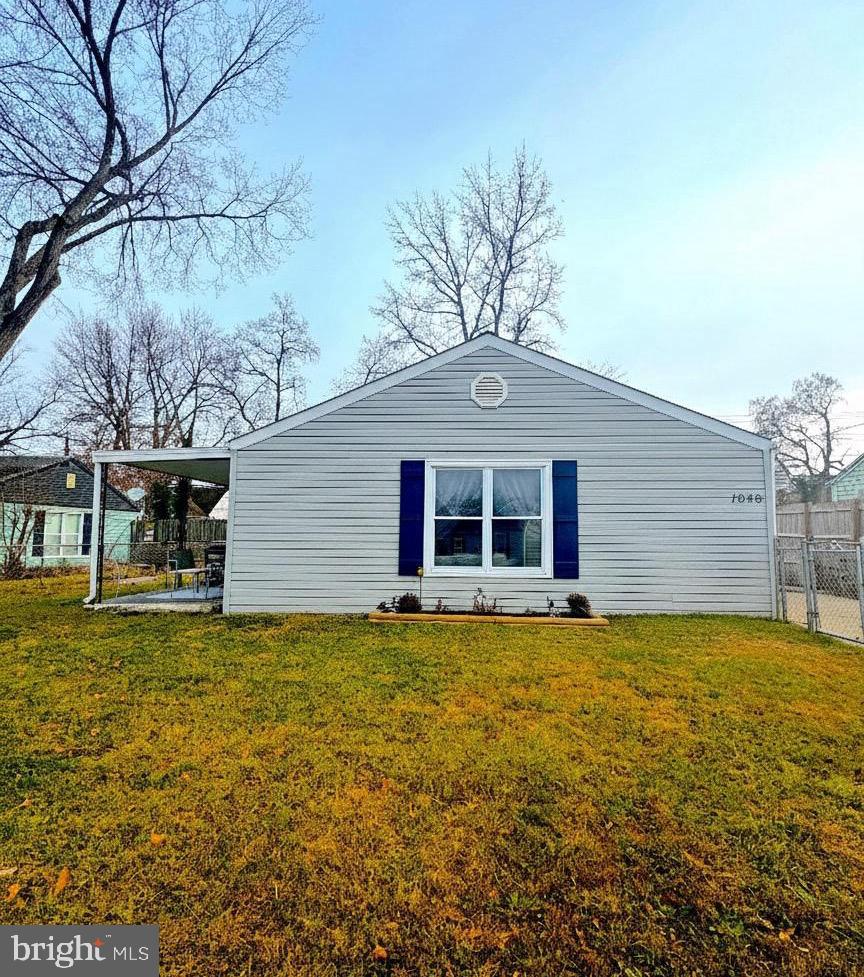 1046 Thomas Road Glen Burnie, MD 21060 - Photo 2 of 30 a view of a house with a yard