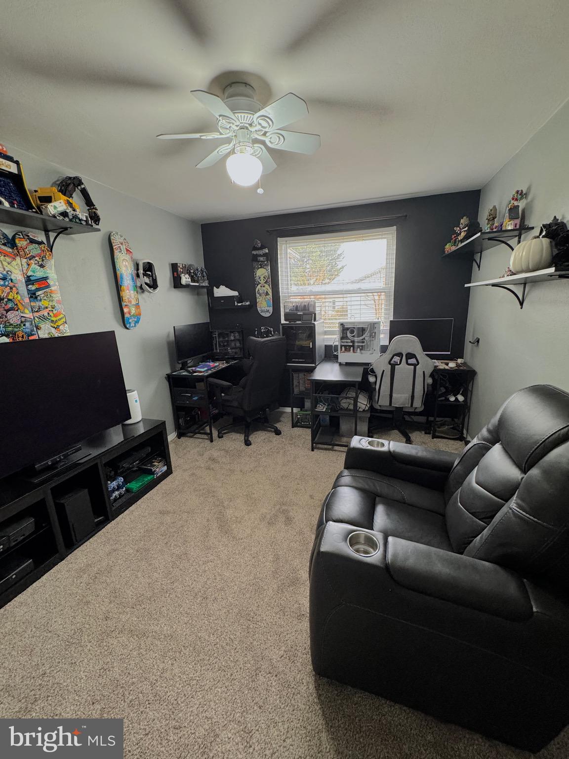 1046 Thomas Road Glen Burnie, MD 21060 - Photo 21 of 30 a living room with furniture and a flat screen tv