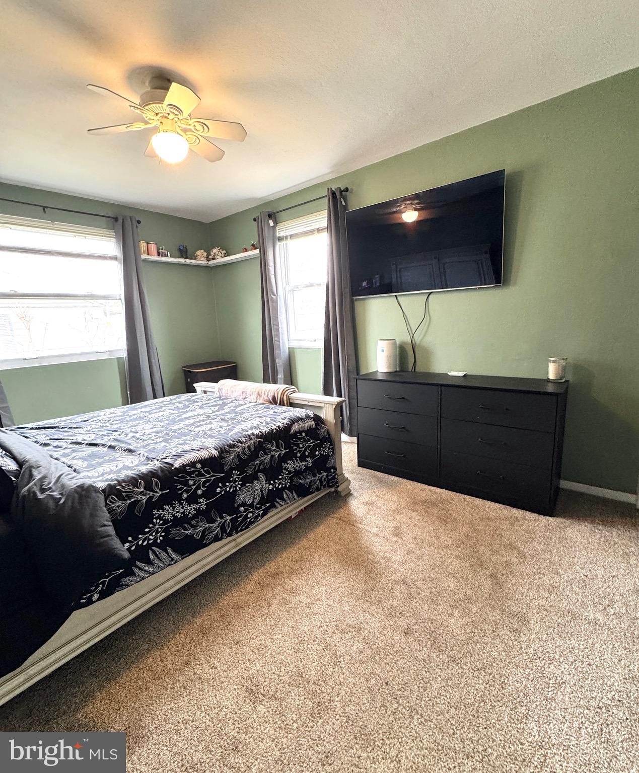 1046 Thomas Road Glen Burnie, MD 21060 - Photo 23 of 30 a bedroom with a bed and a chandelier