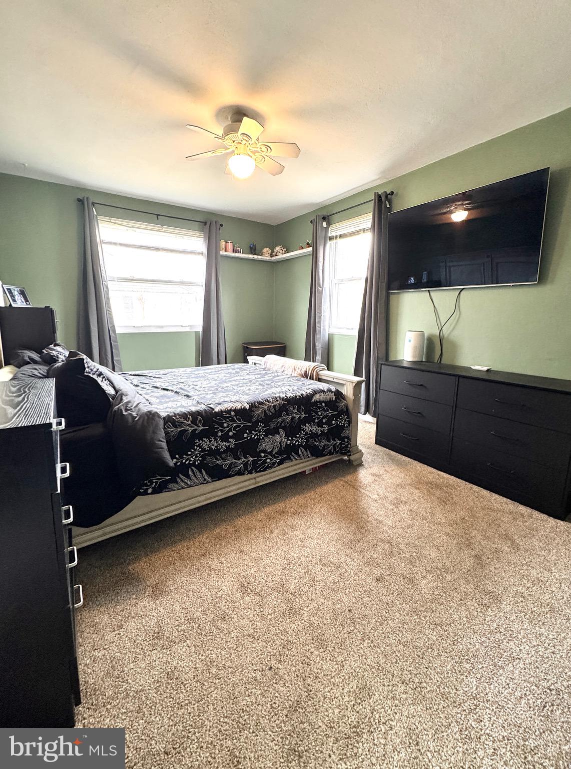 1046 Thomas Road Glen Burnie, MD 21060 - Photo 24 of 30 a bedroom with a bed and a large window