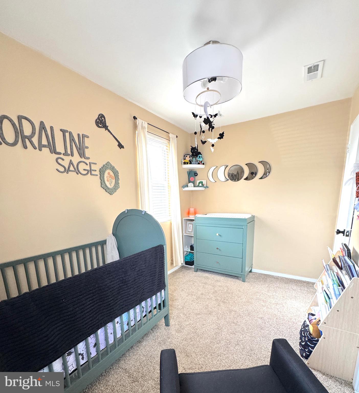 1046 Thomas Road Glen Burnie, MD 21060 - Photo 27 of 30 a bedroom with a bed and window