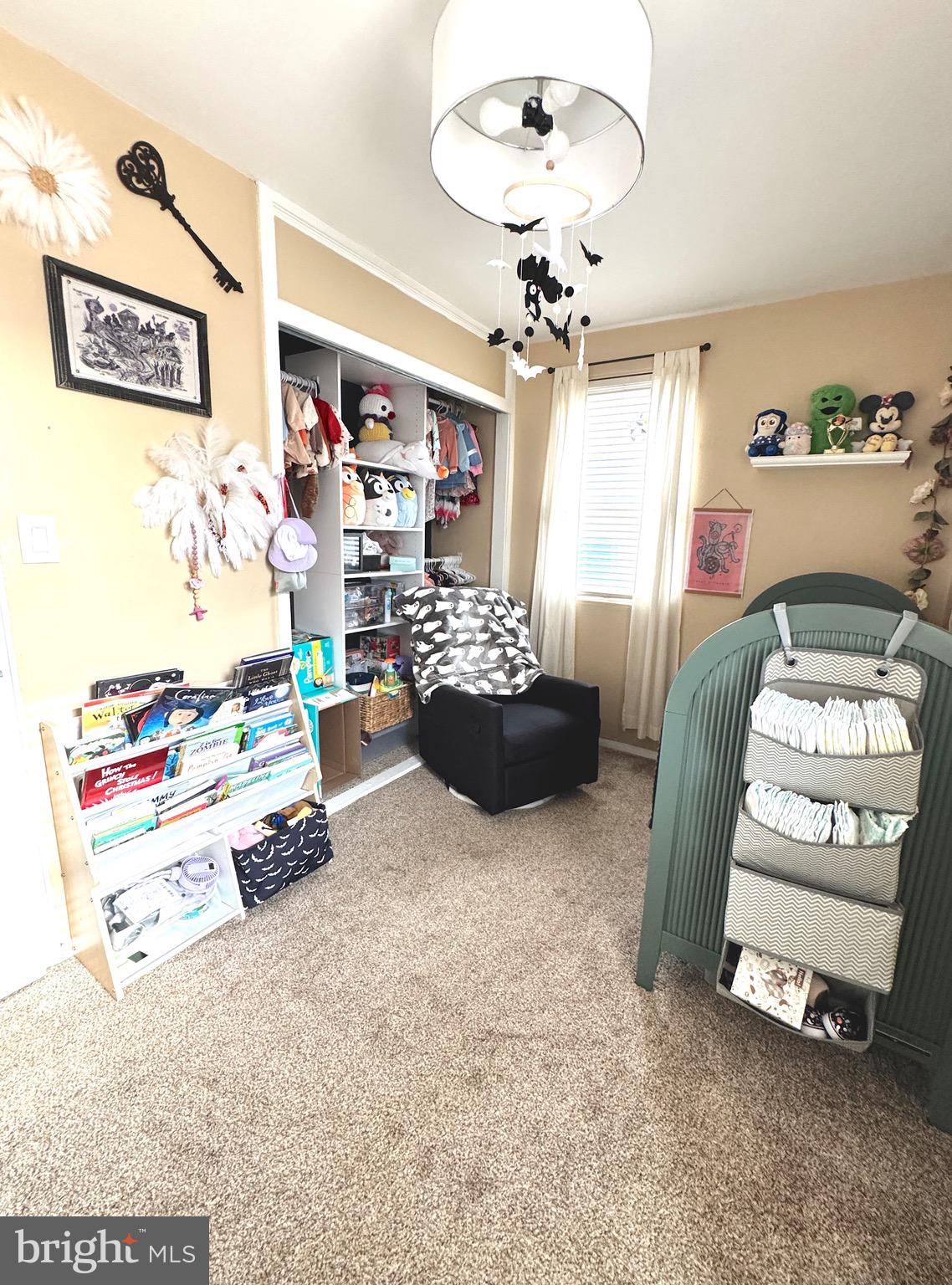 1046 Thomas Road Glen Burnie, MD 21060 - Photo 28 of 30 a living room with furniture and a chandelier