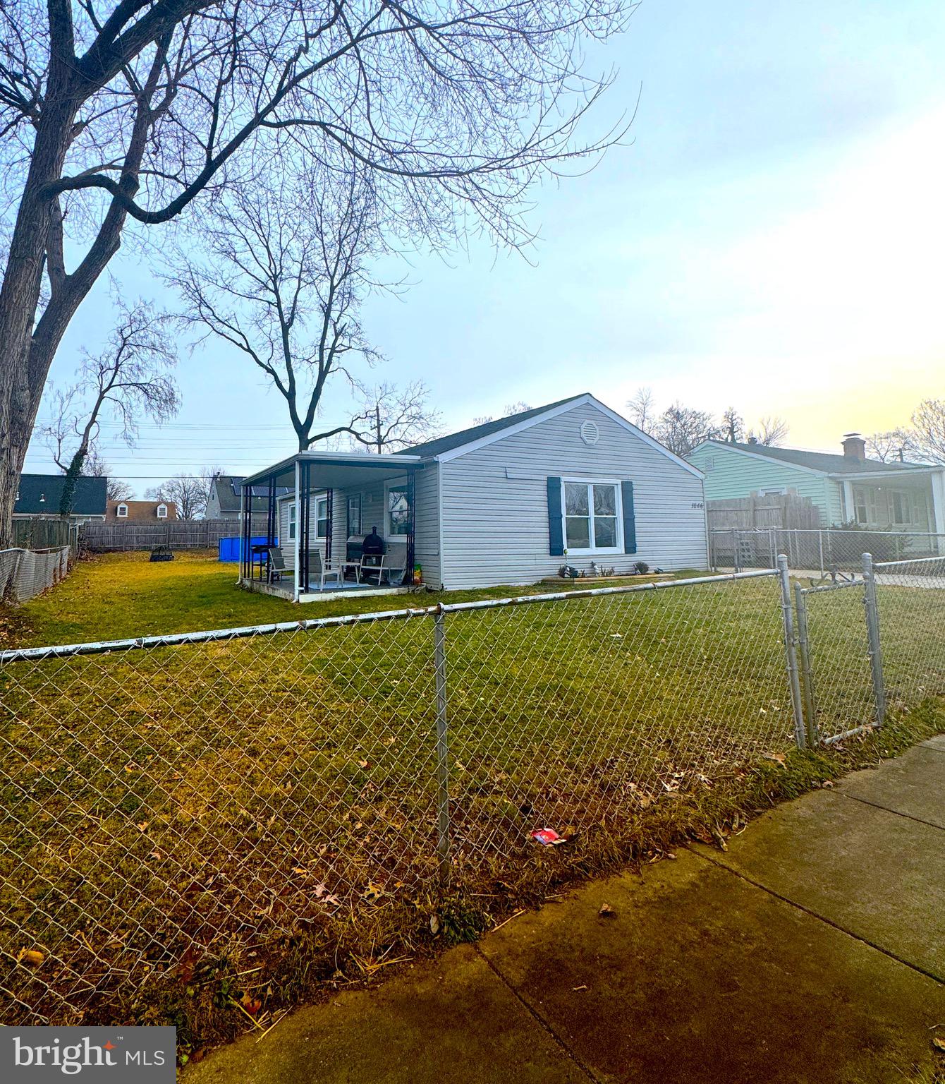 1046 Thomas Road Glen Burnie, MD 21060 - Photo 3 of 30 a house view with swimming pool in front of it