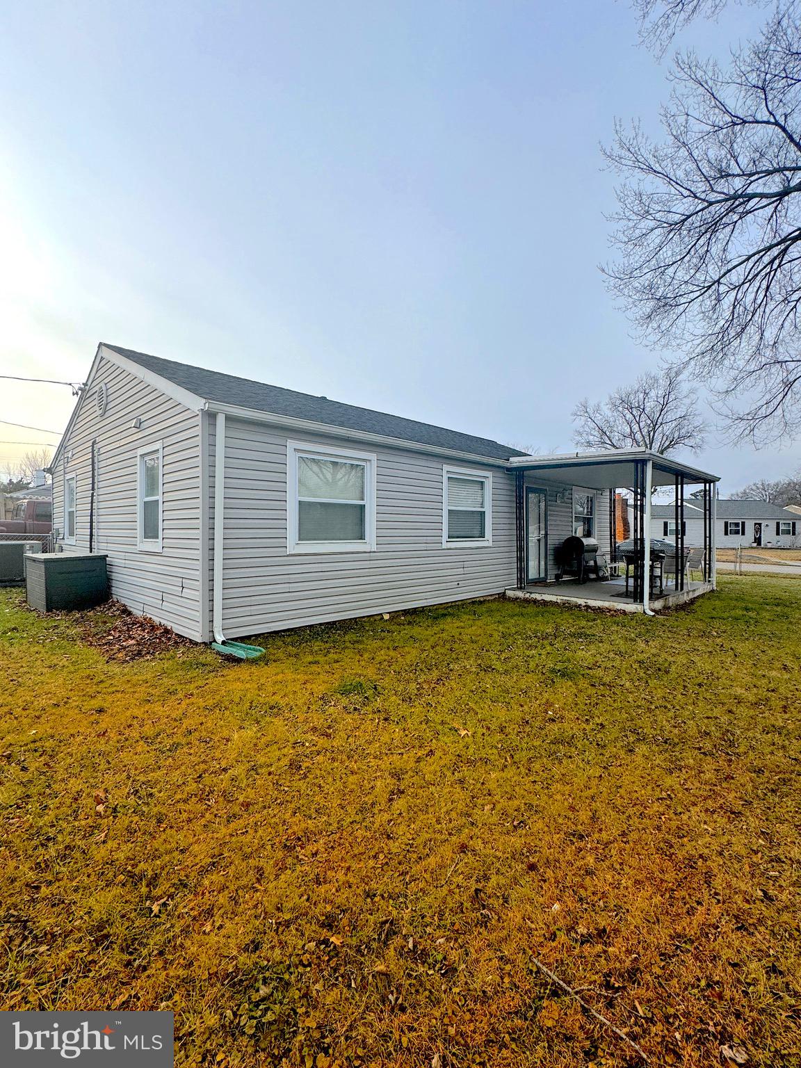 1046 Thomas Road Glen Burnie, MD 21060 - Photo 4 of 30 a front view of a house with a yard
