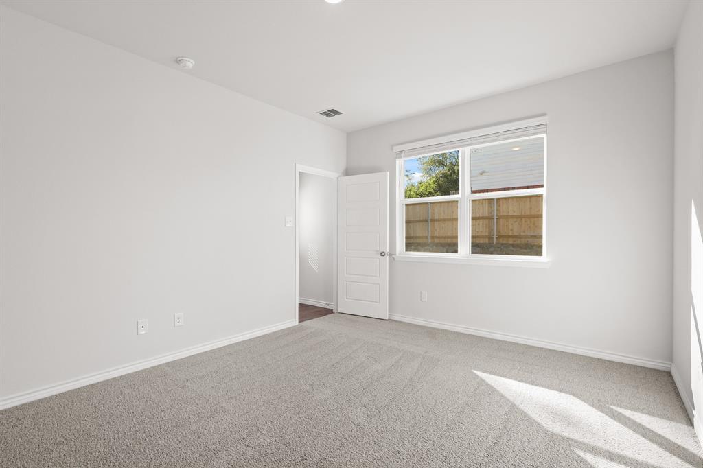 7904 Bald Cypress Road Fort Worth, TX 76123 - Photo 11 of 23 an empty room with windows