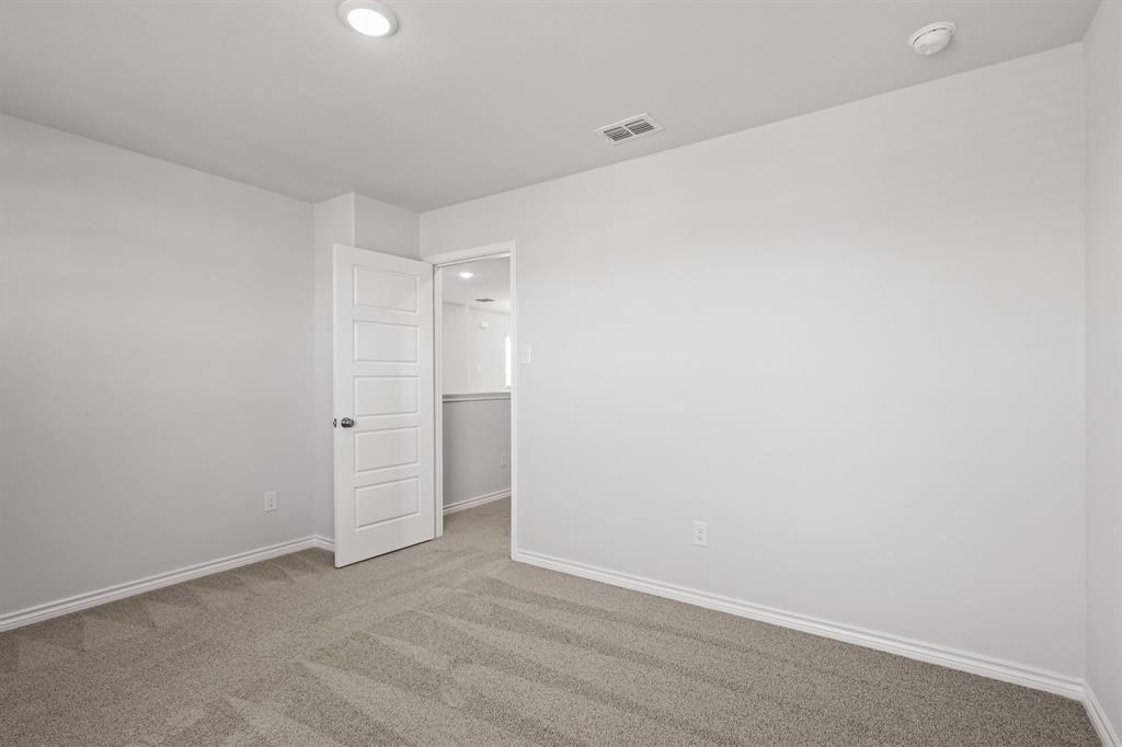 7904 Bald Cypress Road Fort Worth, TX 76123 - Photo 15 of 23 a view of an empty room
