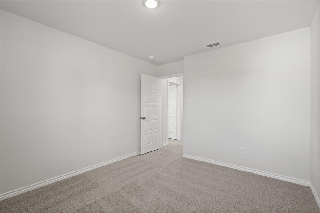 7904 Bald Cypress Road Fort Worth, TX 76123 - Photo 17 of 23 a view of an empty room