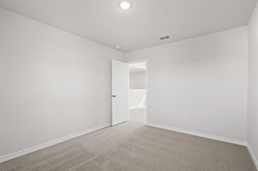 7904 Bald Cypress Road Fort Worth, TX 76123 - Photo 19 of 23 a view of an empty room