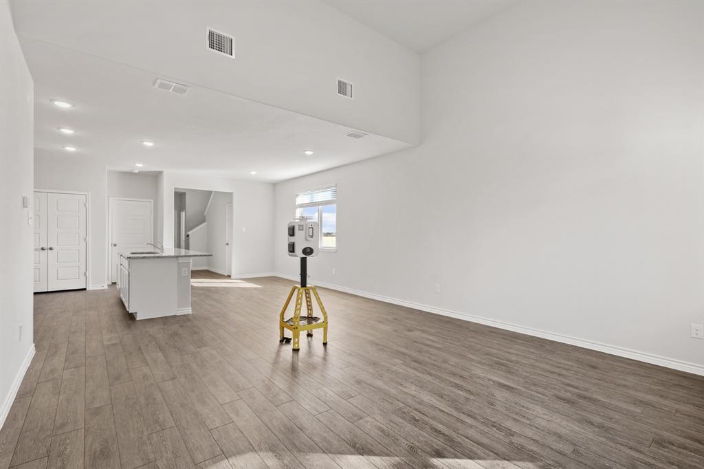 7904 Bald Cypress Road Fort Worth, TX 76123 - Photo 8 of 23 a view of a living room and kitchen