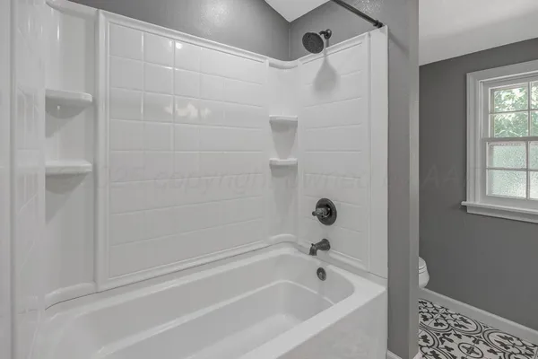 a bathroom with a bathtub