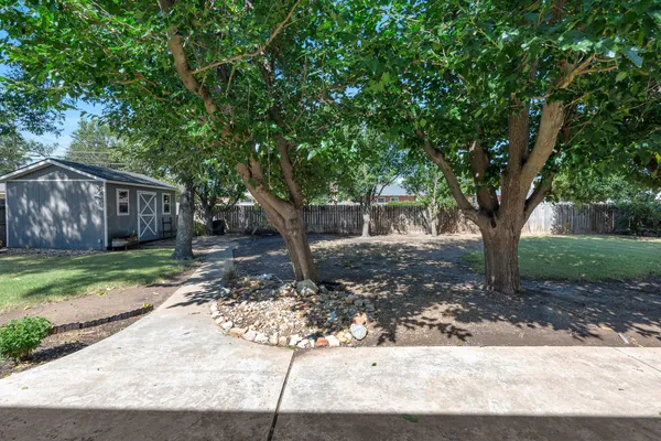 a backyard of a house with lots of green space