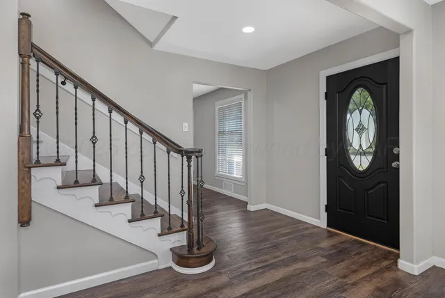 a view of entryway with wooden floor