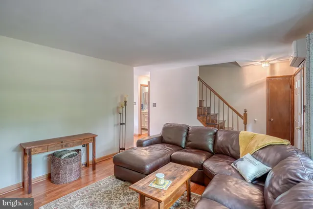 a kitchen with sink refrigerator dining table and chairs