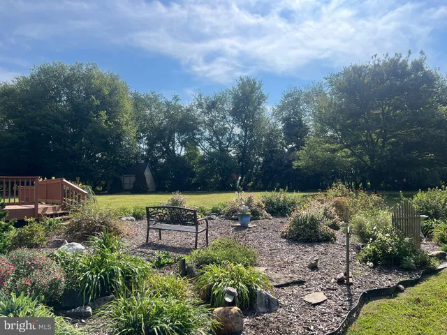 a view of a swimming pool with an outdoor space and seating area