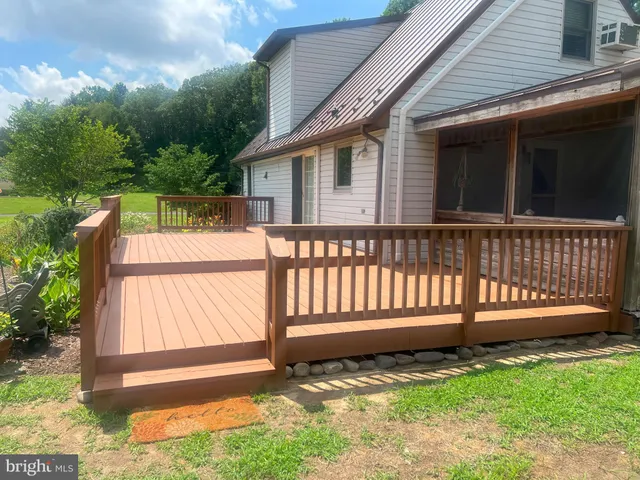 a view of a house with garden and yard