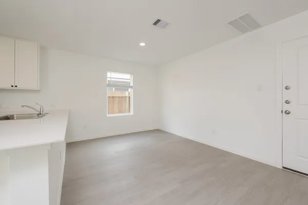 a view of an empty room with a sink