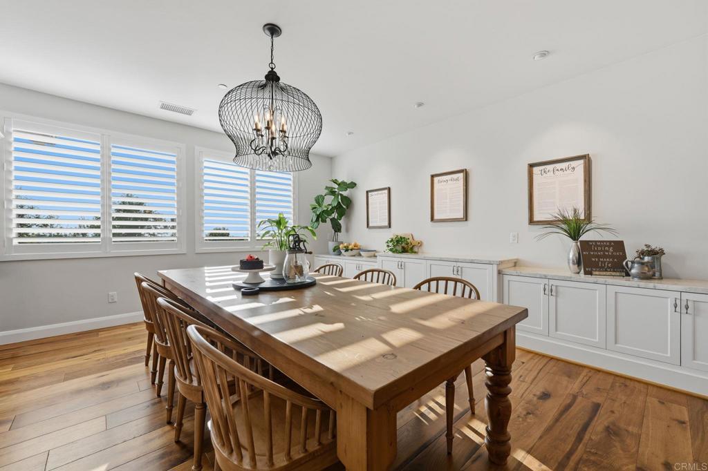 2263 Corner Creek Lane Fallbrook, CA 92028 - Photo 12 of 73 a view of a dining room with furniture window and wooden floor