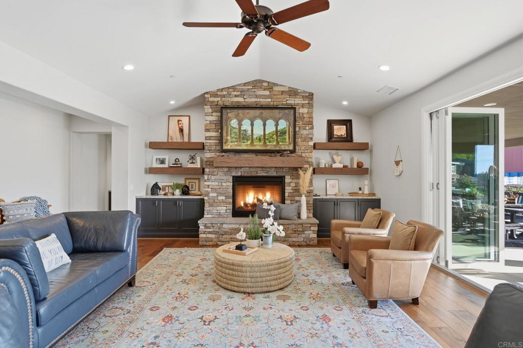 2263 Corner Creek Lane Fallbrook, CA 92028 - Photo 15 of 73 a living room with furniture and a fireplace