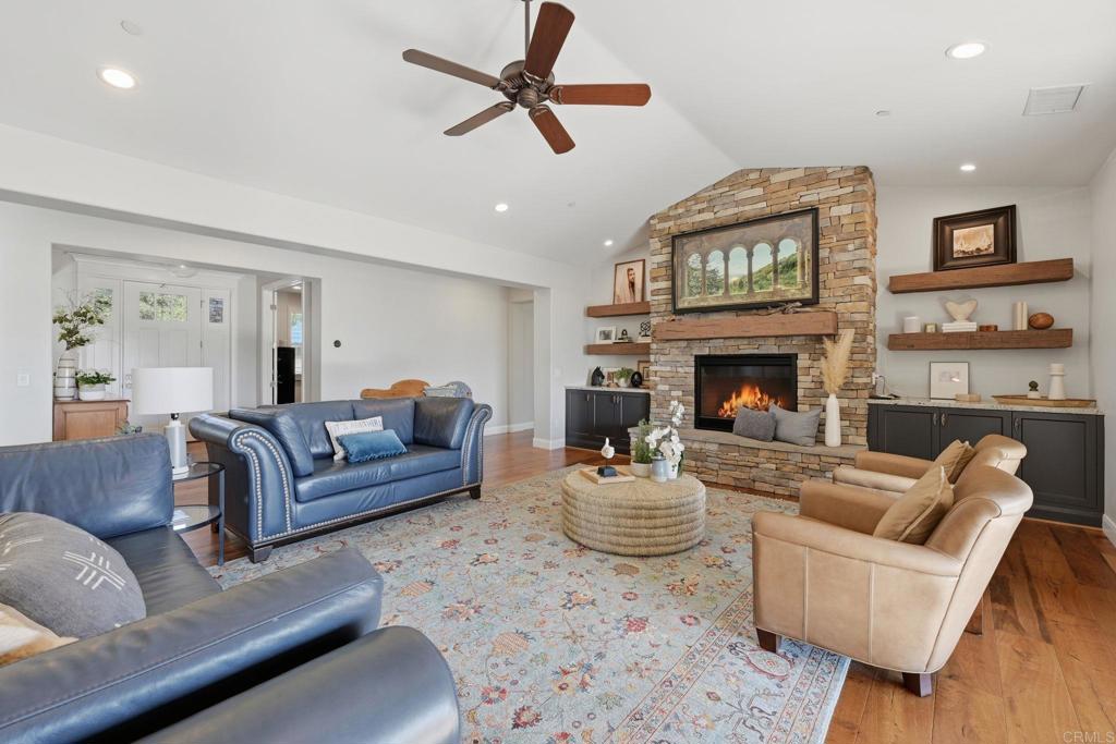 2263 Corner Creek Lane Fallbrook, CA 92028 - Photo 16 of 73 a living room with furniture a window and a fireplace