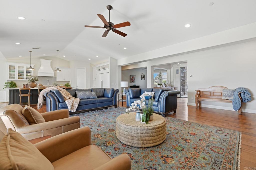 2263 Corner Creek Lane Fallbrook, CA 92028 - Photo 18 of 73 a living room with furniture kitchen view and a chandelier