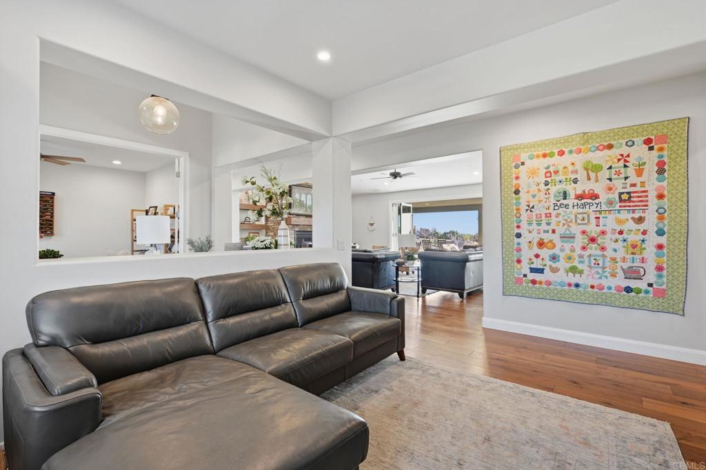 2263 Corner Creek Lane Fallbrook, CA 92028 - Photo 22 of 73 a living room with furniture and a large window