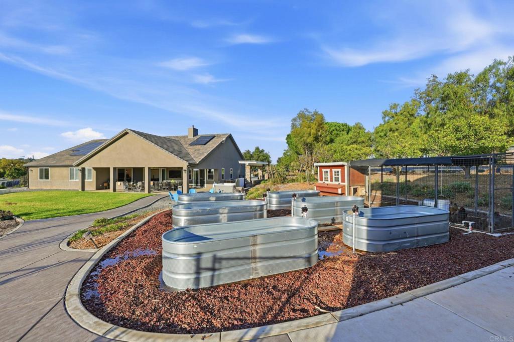 2263 Corner Creek Lane Fallbrook, CA 92028 - Photo 53 of 73 a front view of a house with a yard
