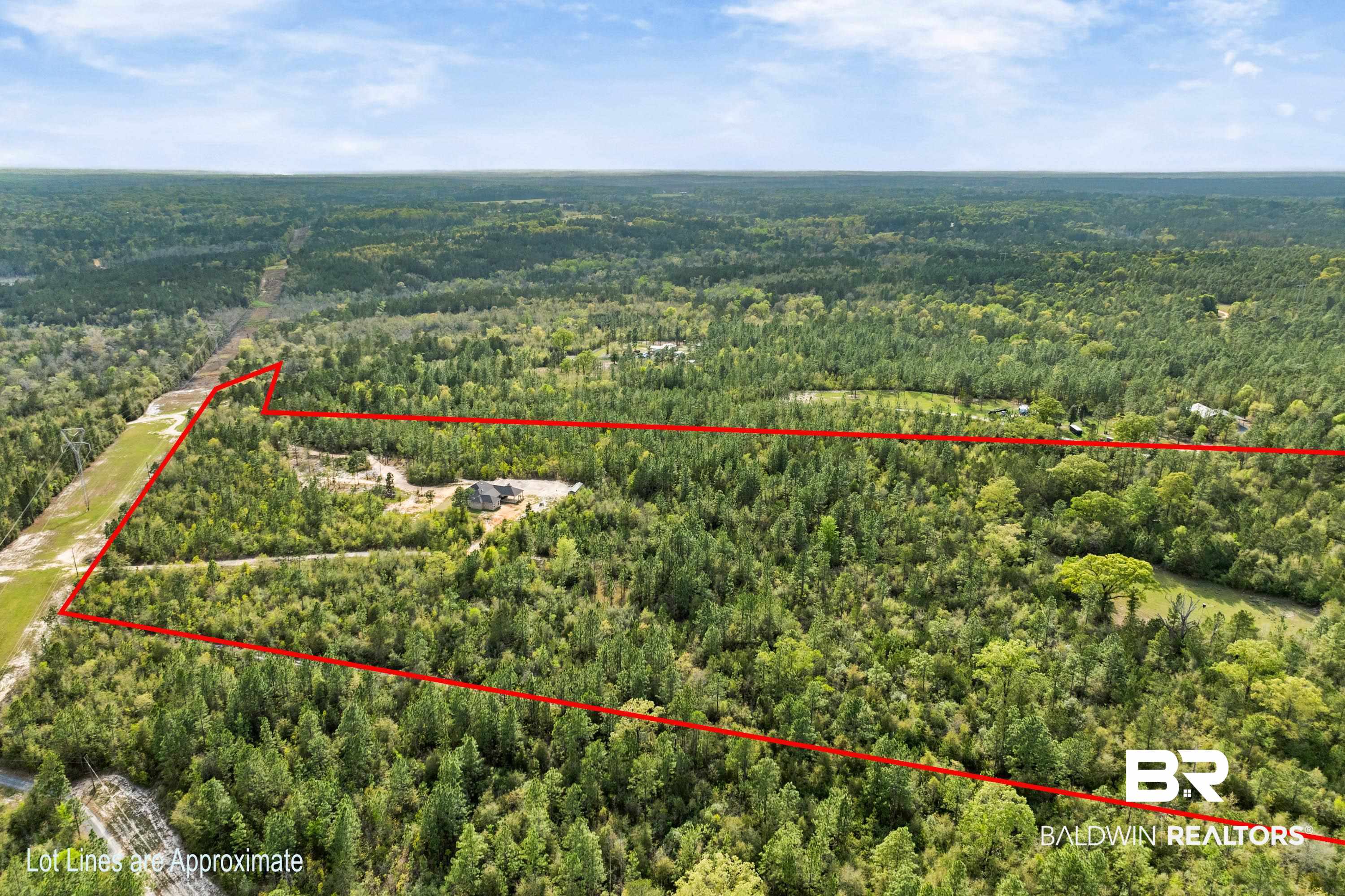 7150 Powell Road, Unit LOT 6A Eight Mile, AL 36613 - Photo 27 of 35 Aerial view of property and surrounding area with a heavily wooded area and property boundaries highlighted