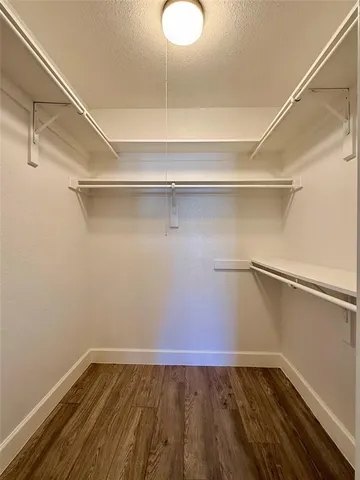 a view of an empty walk in closet