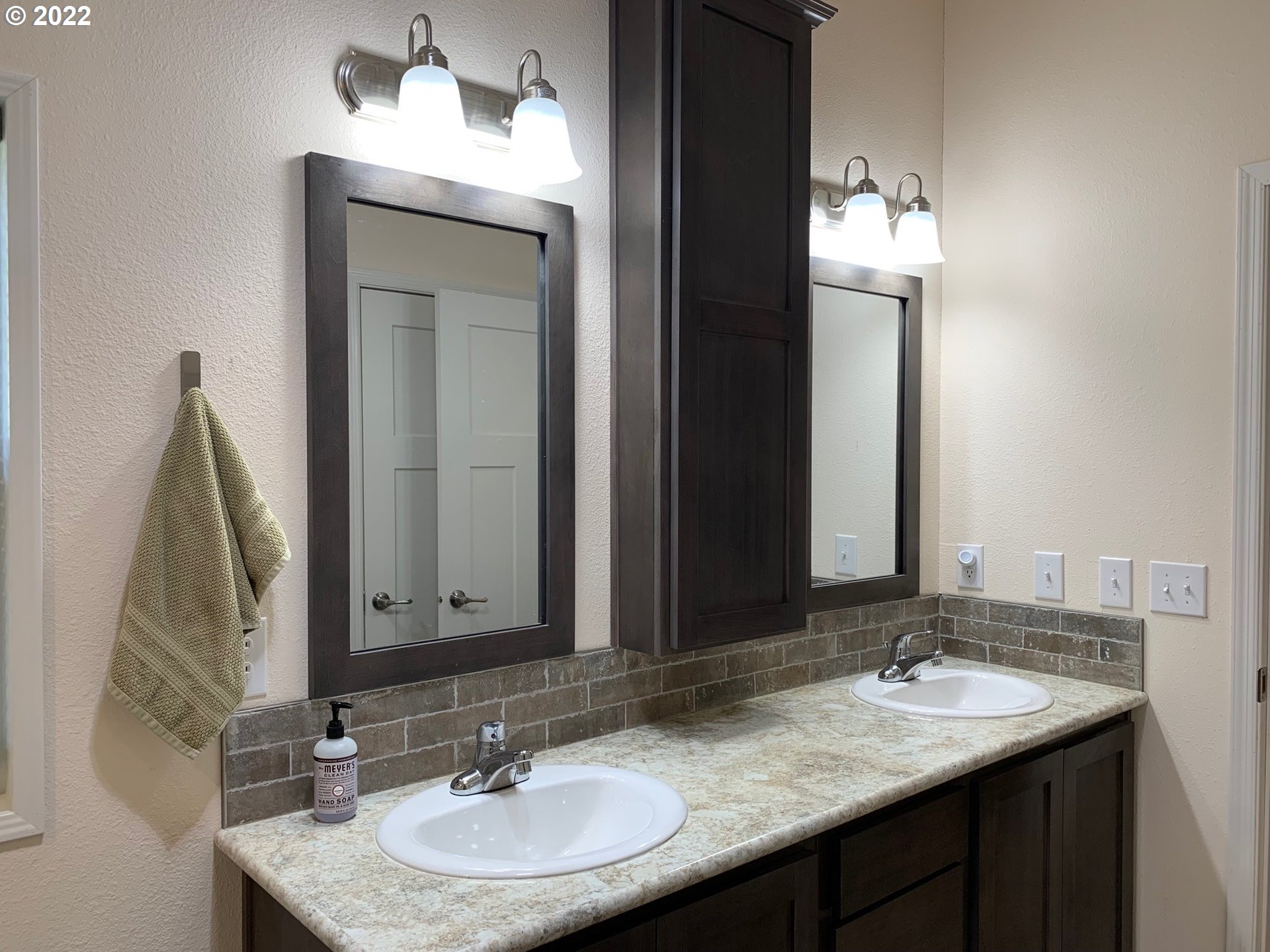 229 Lucky Ridge Loop Canyonville, OR 97417 - Photo 20 of 32 a bathroom with a granite countertop sink and a mirror