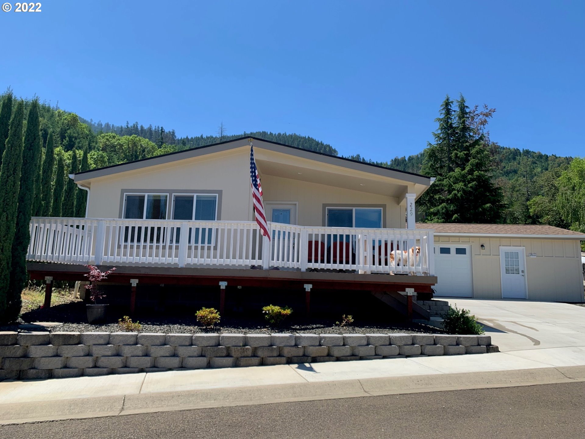 229 Lucky Ridge Loop Canyonville, OR 97417 - Photo 2 of 32 a view of a house with a balcony