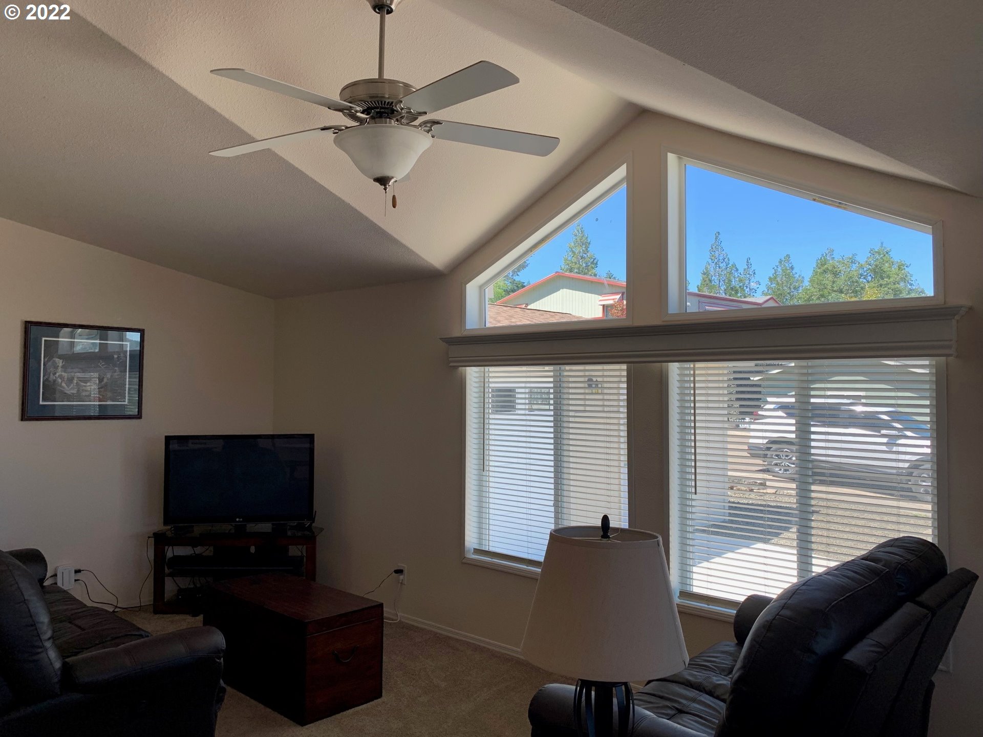 229 Lucky Ridge Loop Canyonville, OR 97417 - Photo 7 of 32 a living room with furniture and a flat screen tv